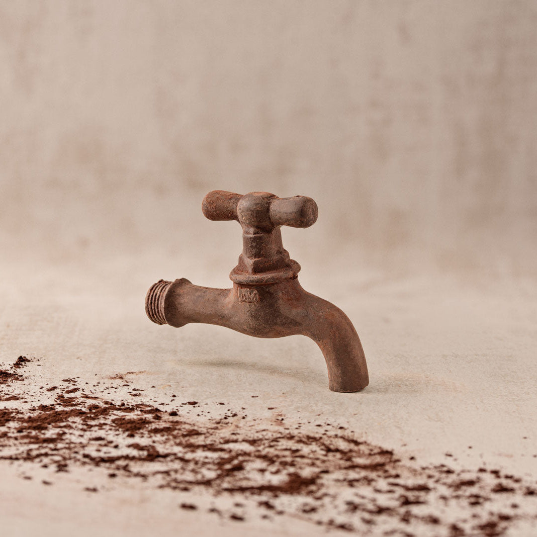 Wasserhahn aus zartbitter Schokolade